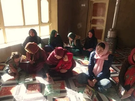 Women gathered near a window during a group session.